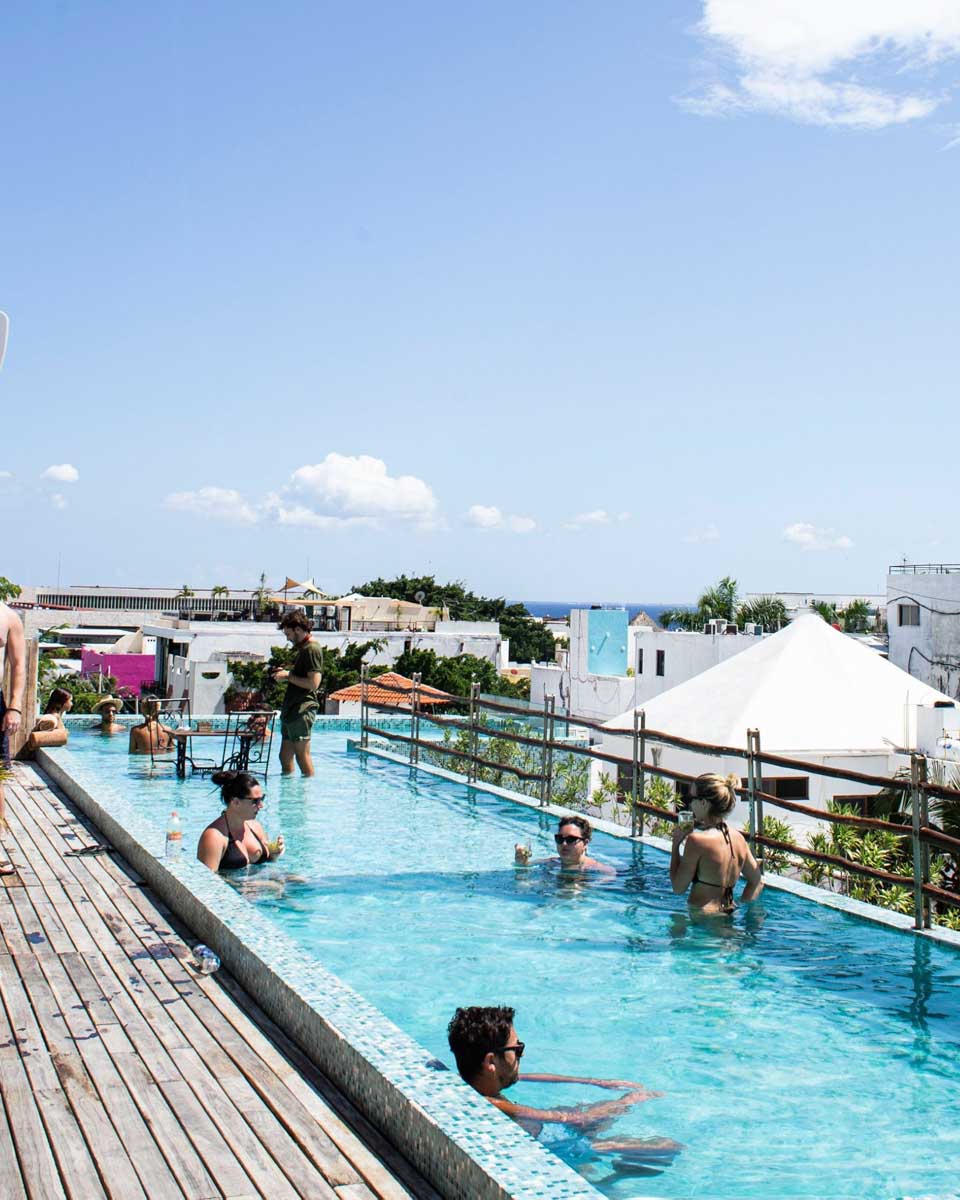 People enjoy the pool at Be Playa Rooftop Pool, Playa del Carmen, Mexico