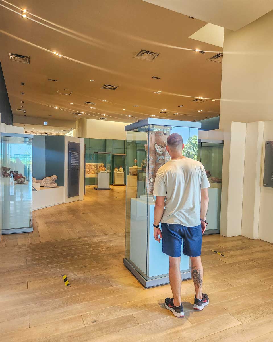 Daniel looks at a display at the Museo Maya de Cancún