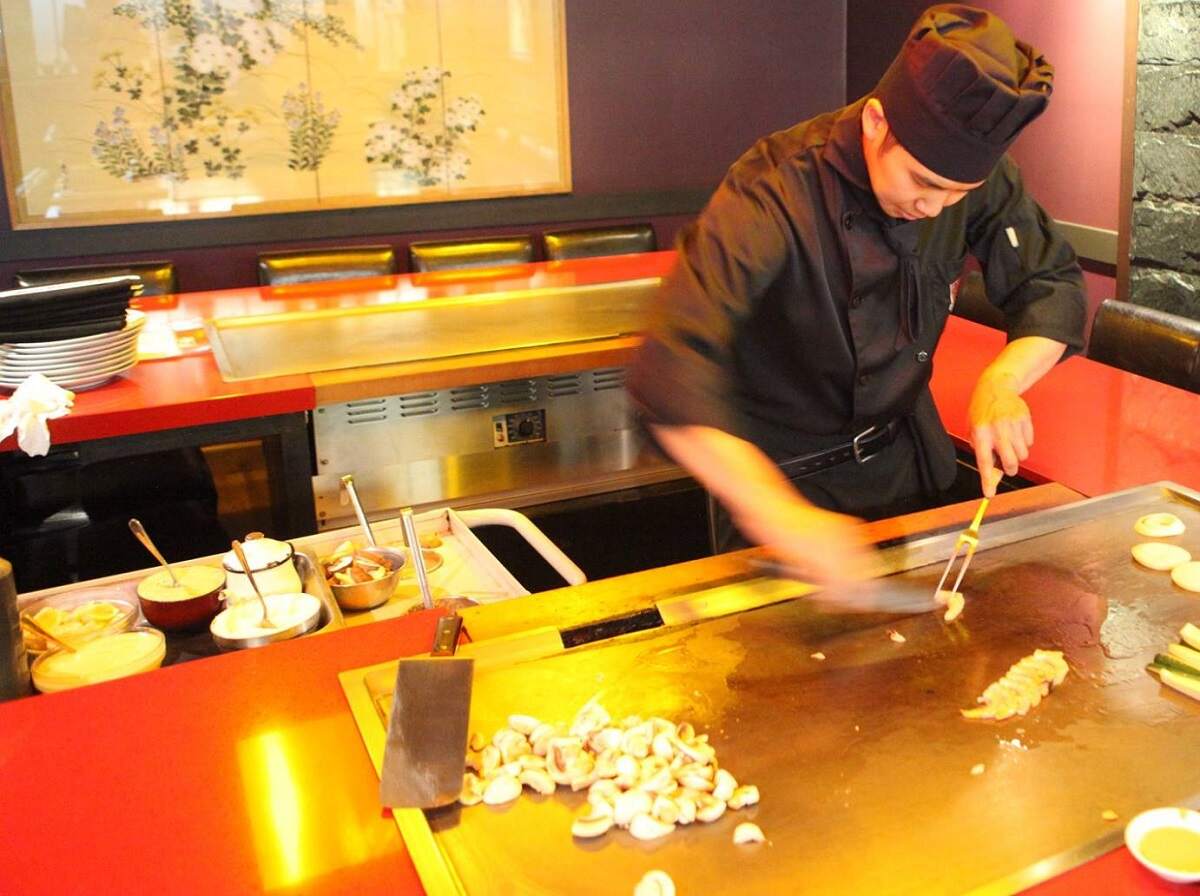 cook doing tepen-yaki at Japanese Village in Edmonton