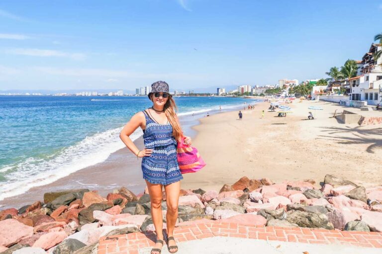Bailey poses for a photos with Playa Camarones, Puerto Vallarta