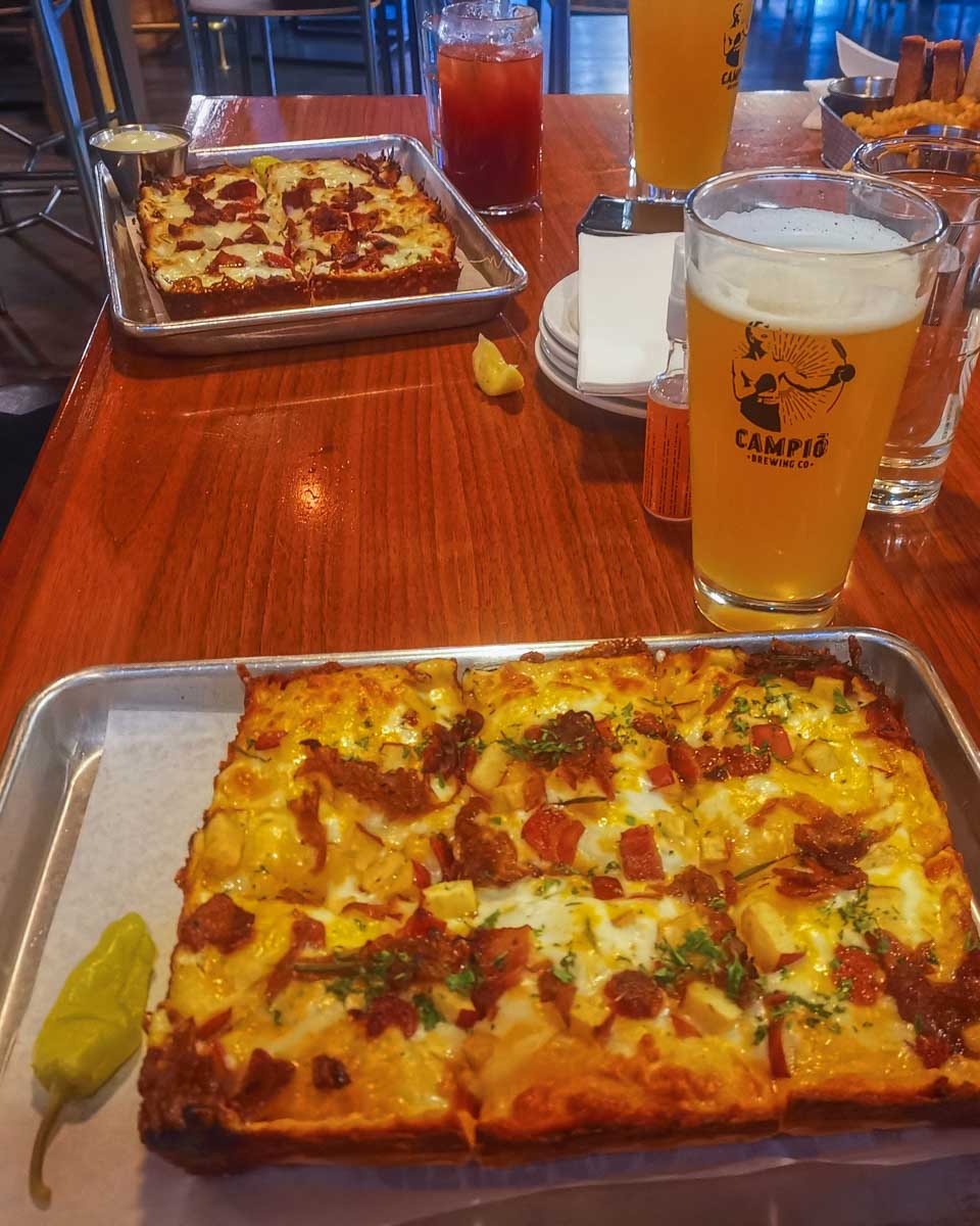 Two pizzas and a beer at Campio Brewing, Edmonton