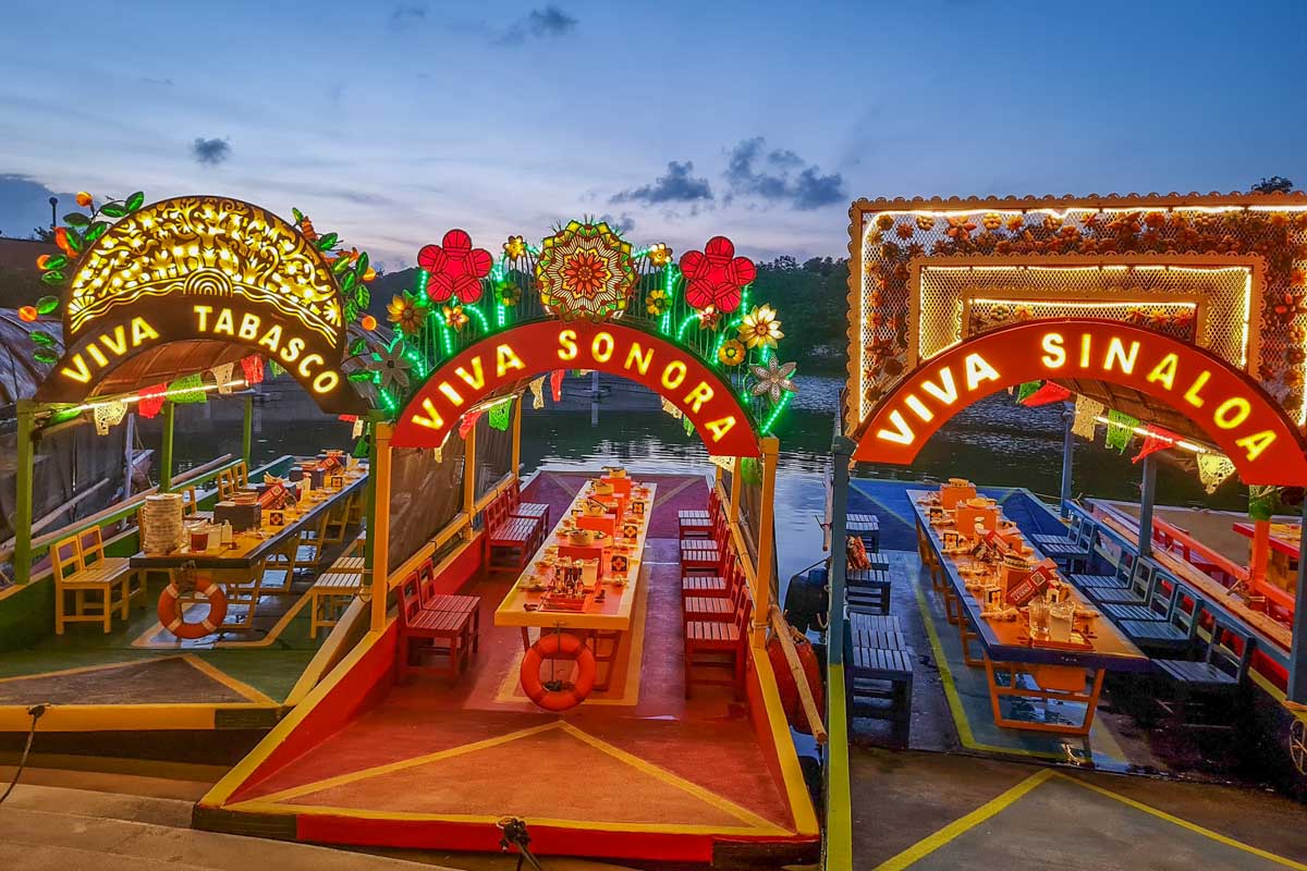 Some of the boats with set tables at Xoximilco Cancun