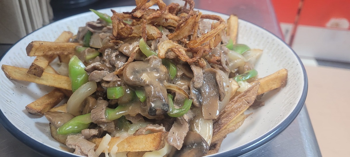 fries covered in gravy, beef, and mushrooms from Rockin Robyn’s Diner in Edmonton