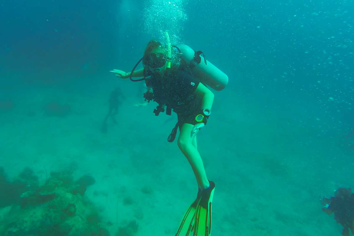 A lady scuba dives in Busselton, Australia