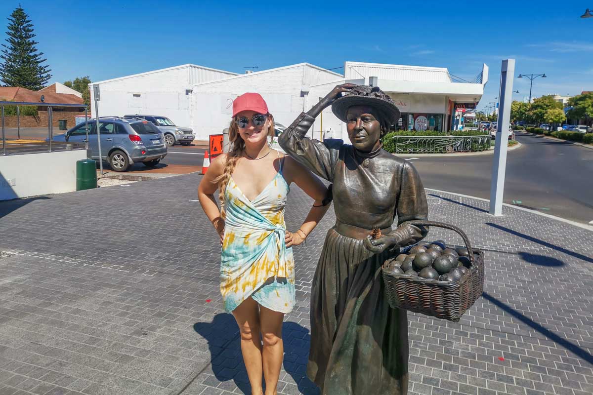 Bailey poses for a photo with a sculpture on the Busselton Heritage Trai