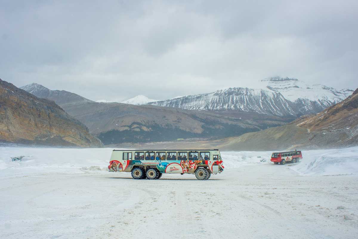 An Ice Explorer all-terrain vehicle parked on the Athabasca Glacier and Columbia Icefield