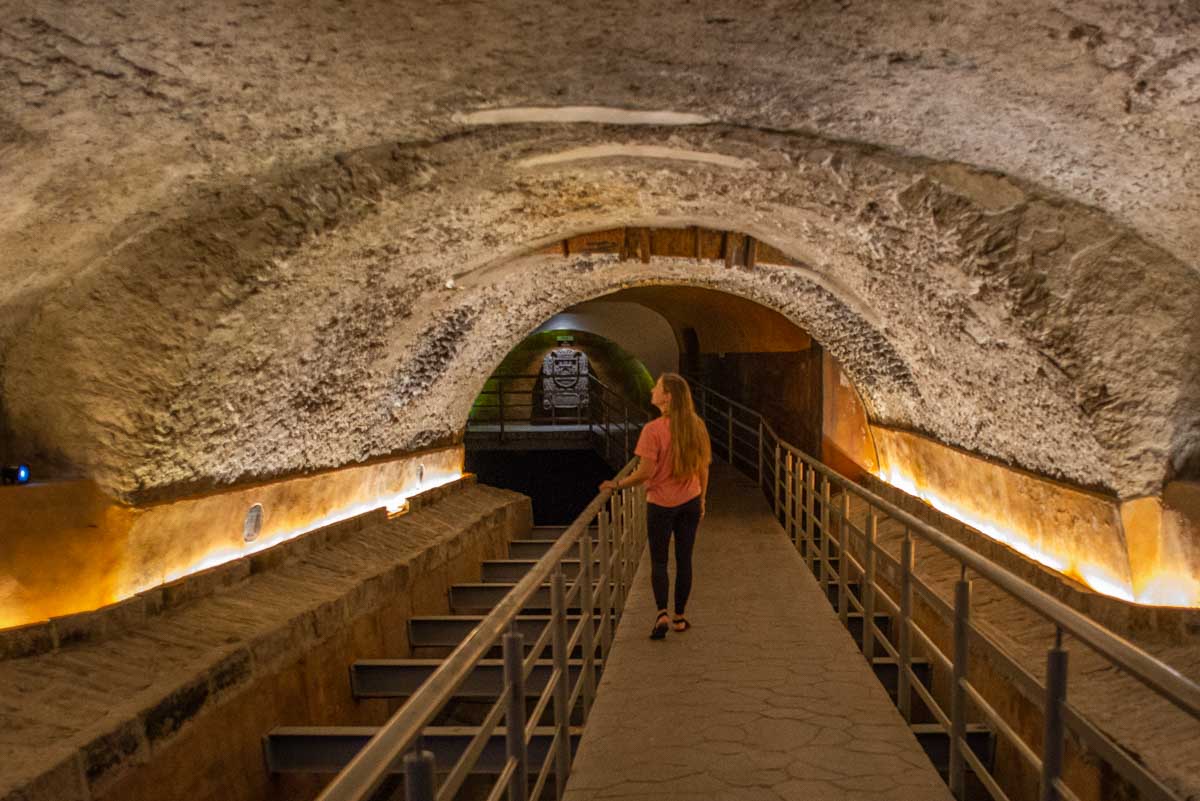 Bailey walks the underground tunnel at Museo de Sitio de El Puente de las Damas, Guadalajara