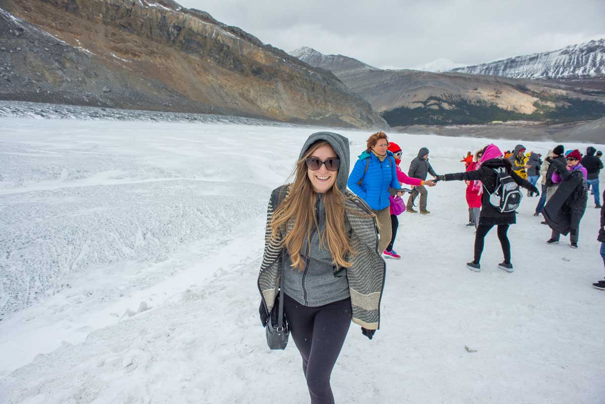 Bailey smiles at the camera on the Athabasca Glacier on a Columbia Icefield Adventure, Canada