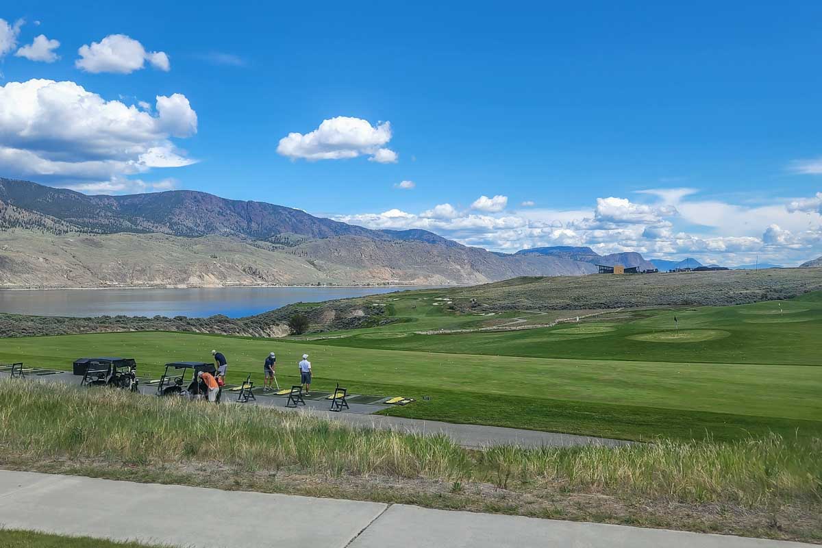 Golfers at the Tobiano Golf Course driving range, Kamloops, BC