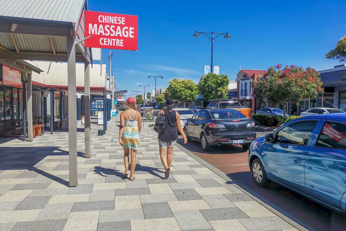 Two people walk Busselton town center