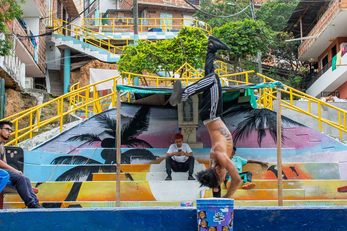 A man does break dancing in Comuna 13, Medellin, Colombia