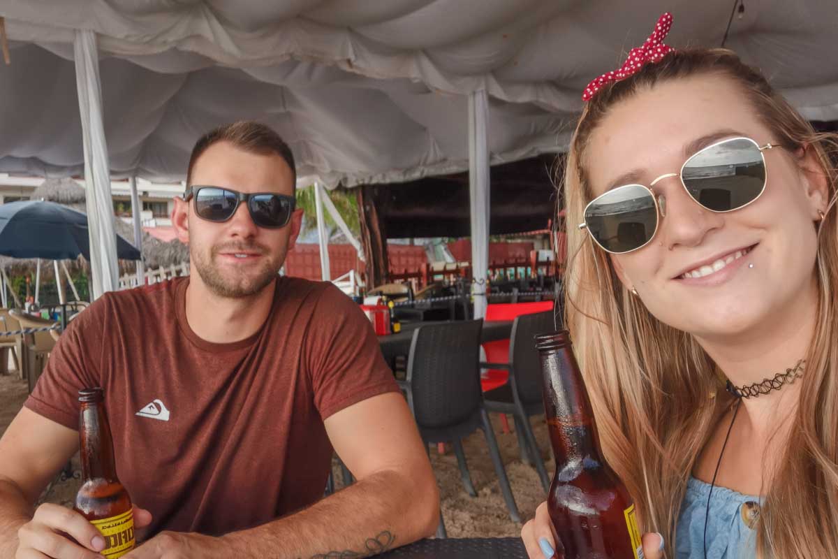 Daniel and Bailey take a selfie with beers in Cancun, Mexico