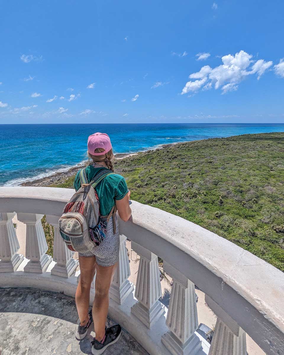Bailey stands at the top of Celarain Lighthouse at Punta Sur Eco Beach Park, Cozumel, Mexico