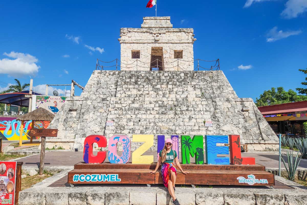 Bailey takes a photo with one of the Cozumel signs on Cozumel, Mexico