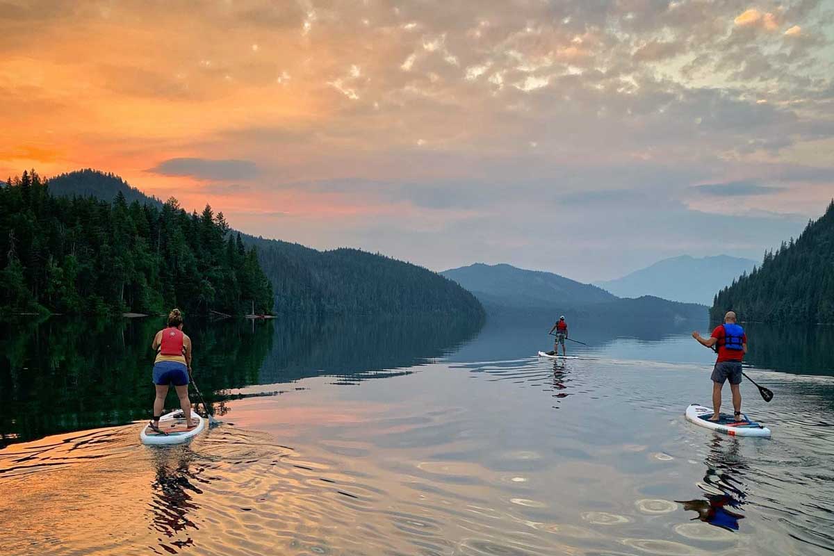 Three people SUP in Clearwater, BC at sunset!