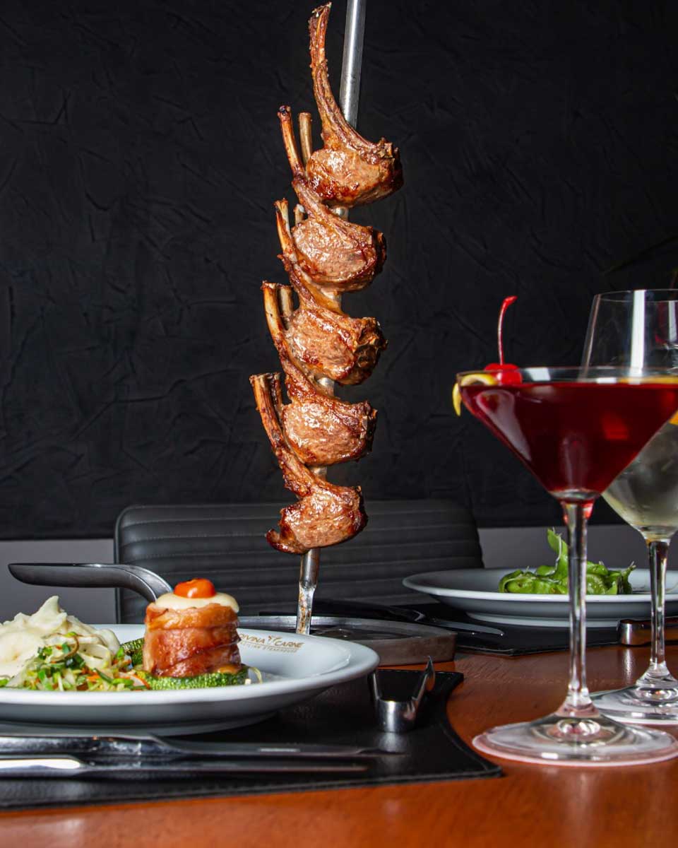 Meals plated and meat on a stick at Divina Carne Cancun