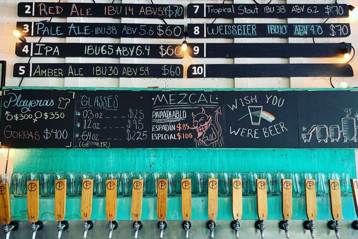 The craft beer taps at Fábrica Casa Cervecera Pescadores 