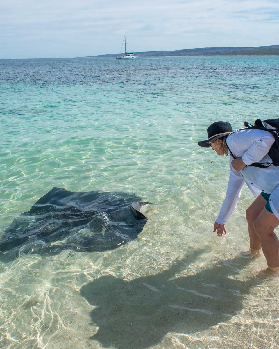 A lady with a sting ray at Hamelin Bay, Margaret River, Western Australia