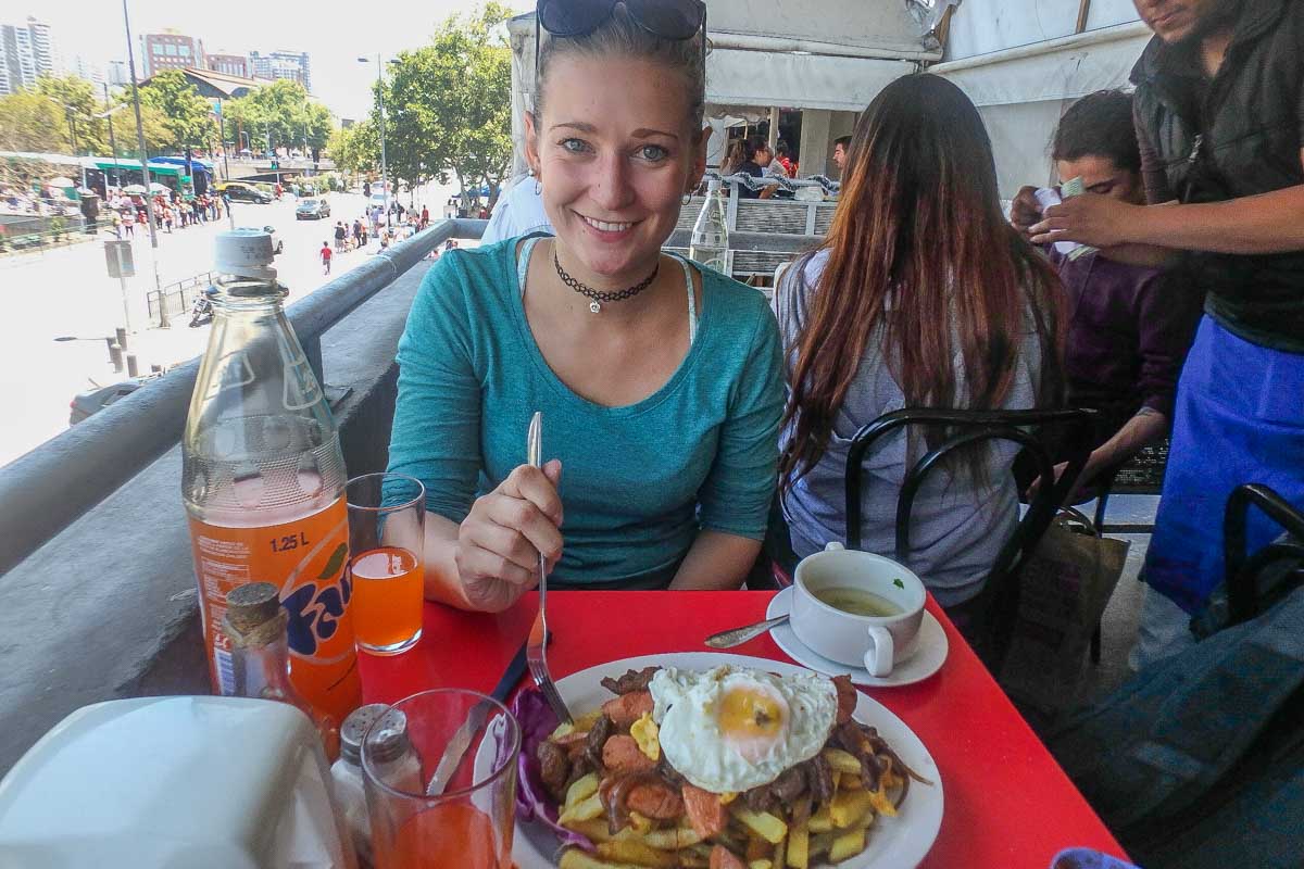 Bailey eats a traditional meal at the Central Market in Santiago, Chile