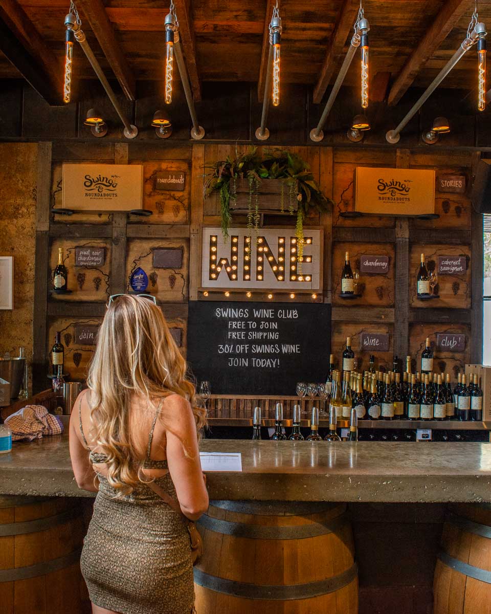 Bailey waits for a tasting at a winery in Margaret River, Australia