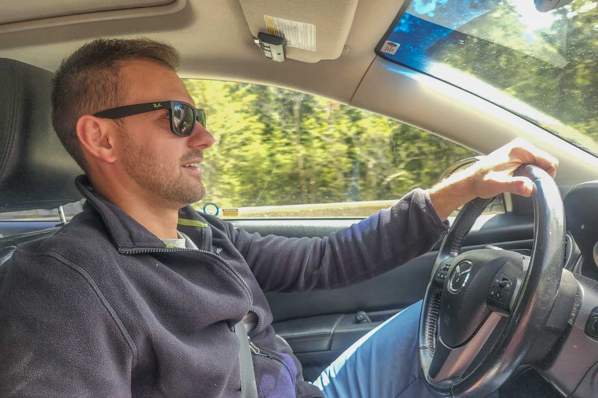 Daniel driving a rental car in Canada