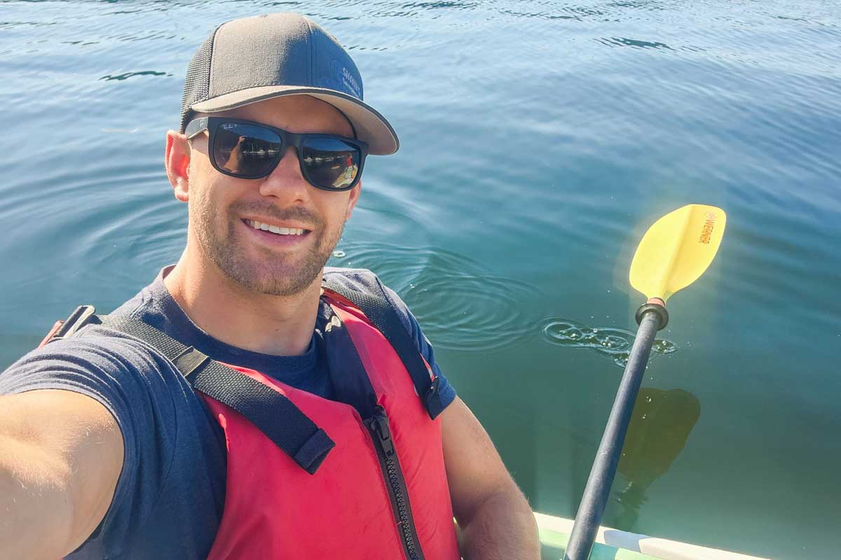 Daniel takes a selfie while kayaking down Margaret River, Western Australia