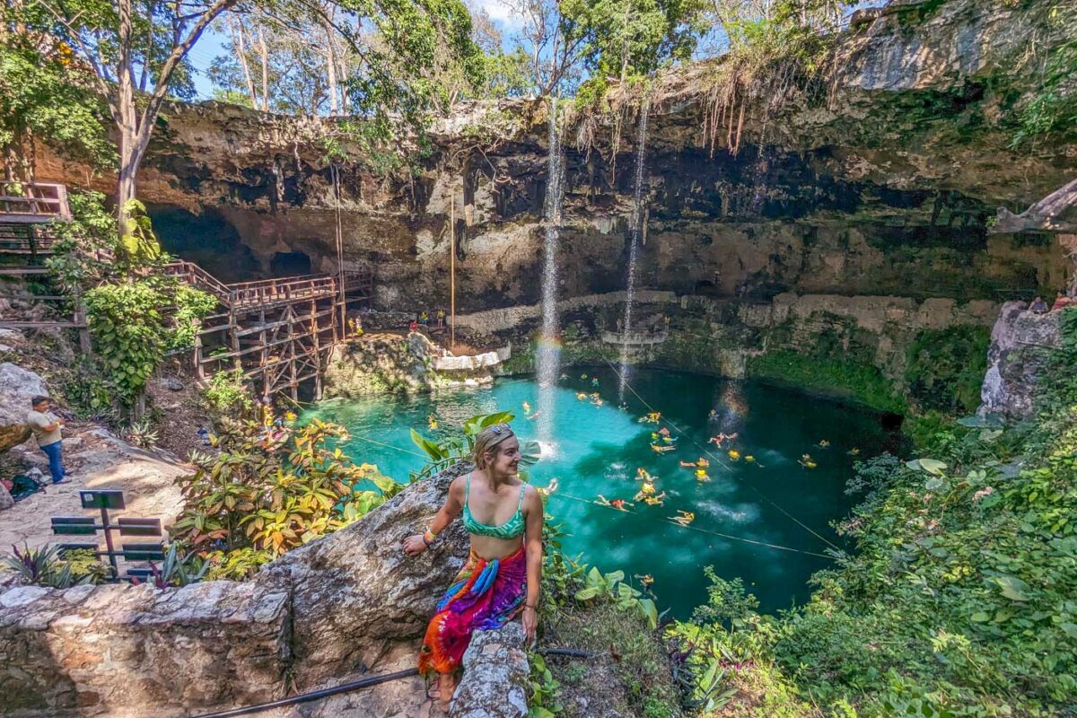 Bailey poses for a photo with Cenote Zaci in Valladolid, Mexico