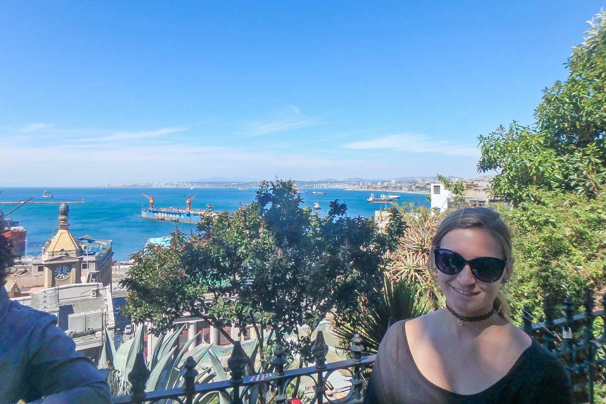 Bailey tales a photo with a view on a paid walking tour of Valparaiso, Chile