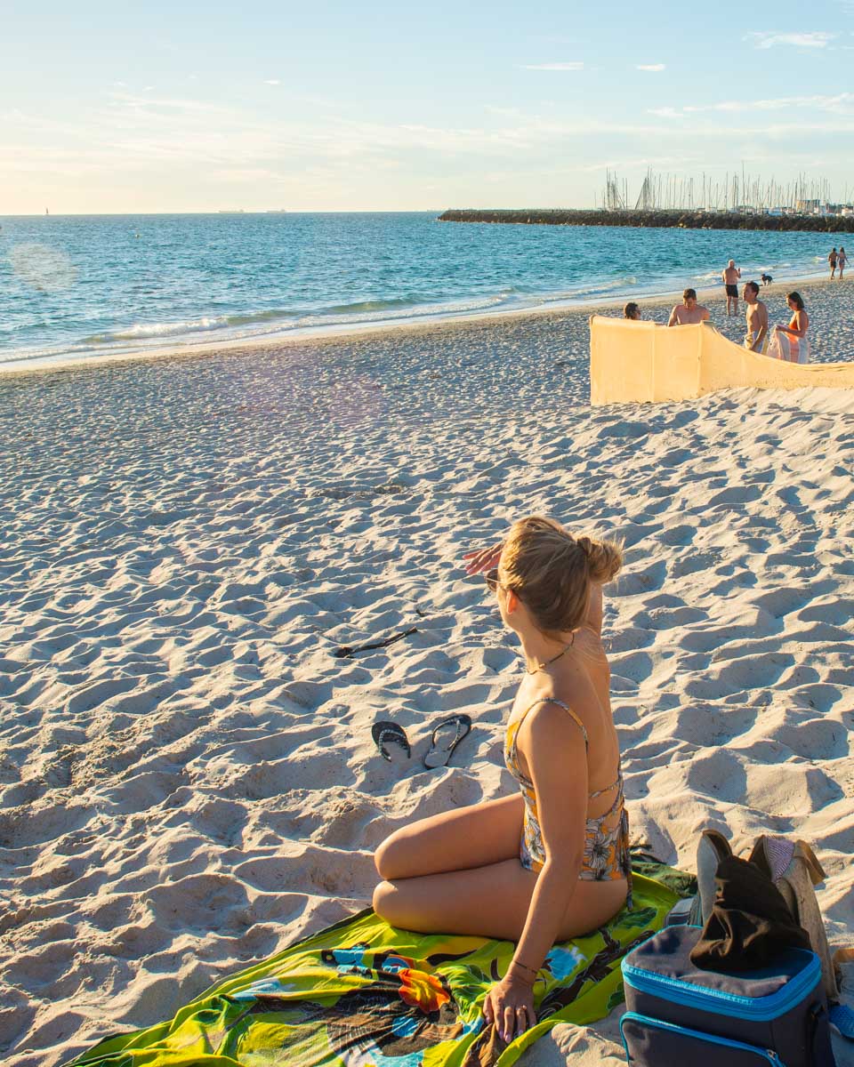 Bailey watches the sunset at South Beach, WA