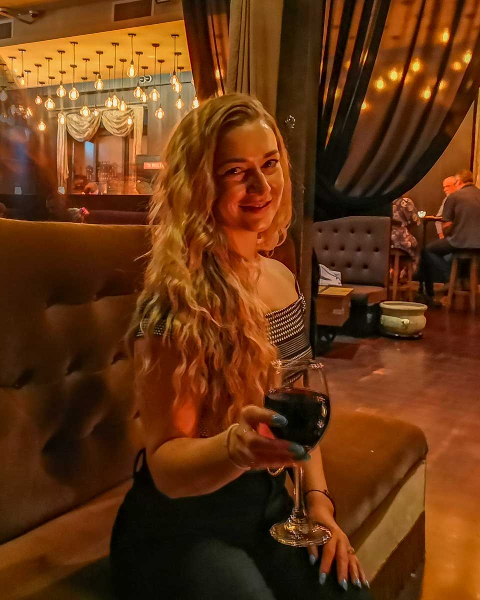 Bailey with a wine at the The Volstead Lounge, Perth