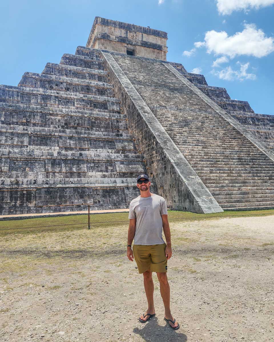 Daniel poses for a photo with the main pyramid at El Castillo, Chichen Itza