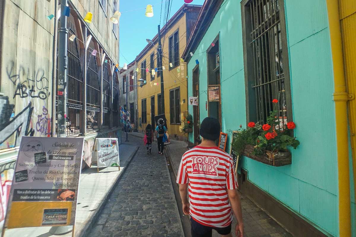 Following a guide on a free walking tour in Valparaiso, Chile