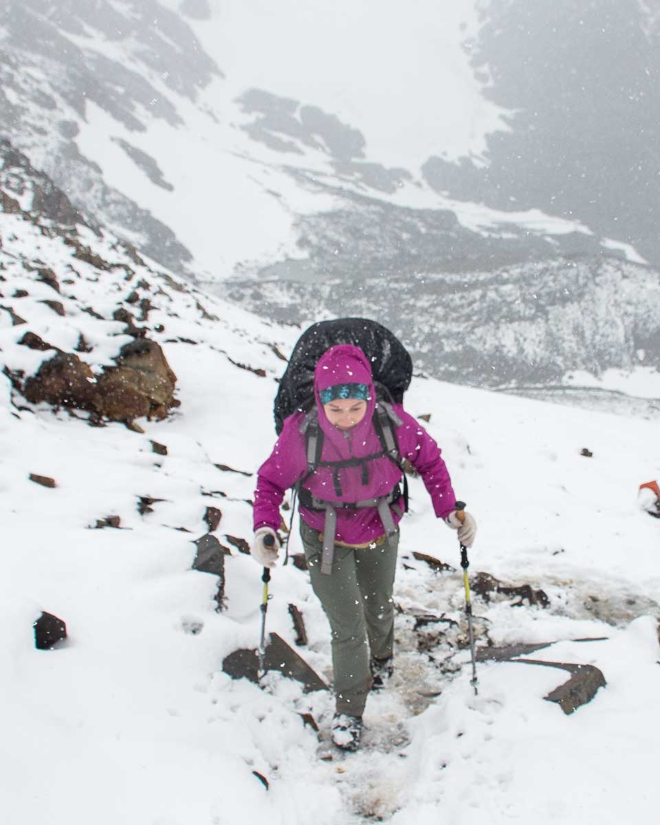 Hiking through snow on Paso John Gardner on the O Circuit