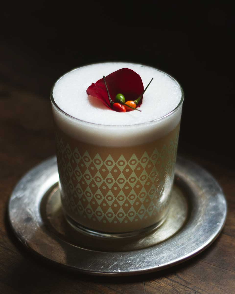 A fancy cocktail in a dark room at Ulew Cocktail Bar in Antigua, Guatemala