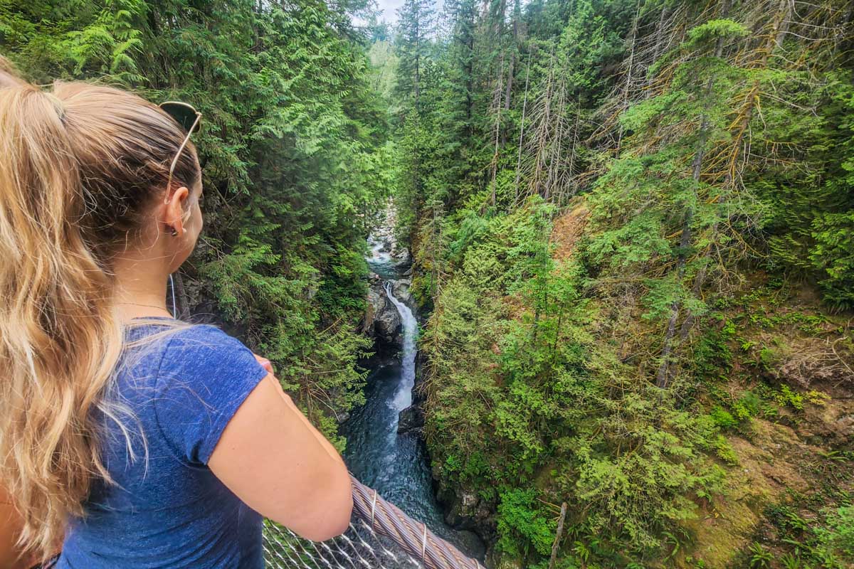 bailey look at a waterfall from the Lynn Canyon Suspension Bridge