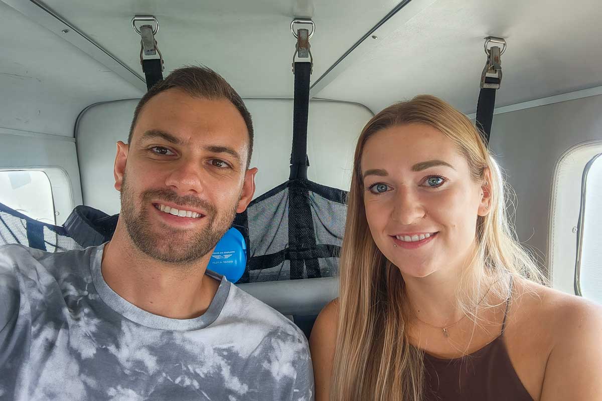 Bailey and Daniel take a selfie on a sea plane in Vancouver