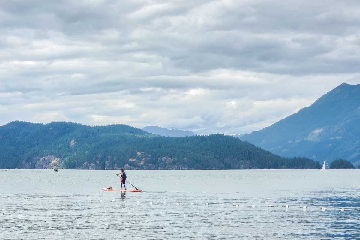 A lady on a SUP on Harrison Lake Canada