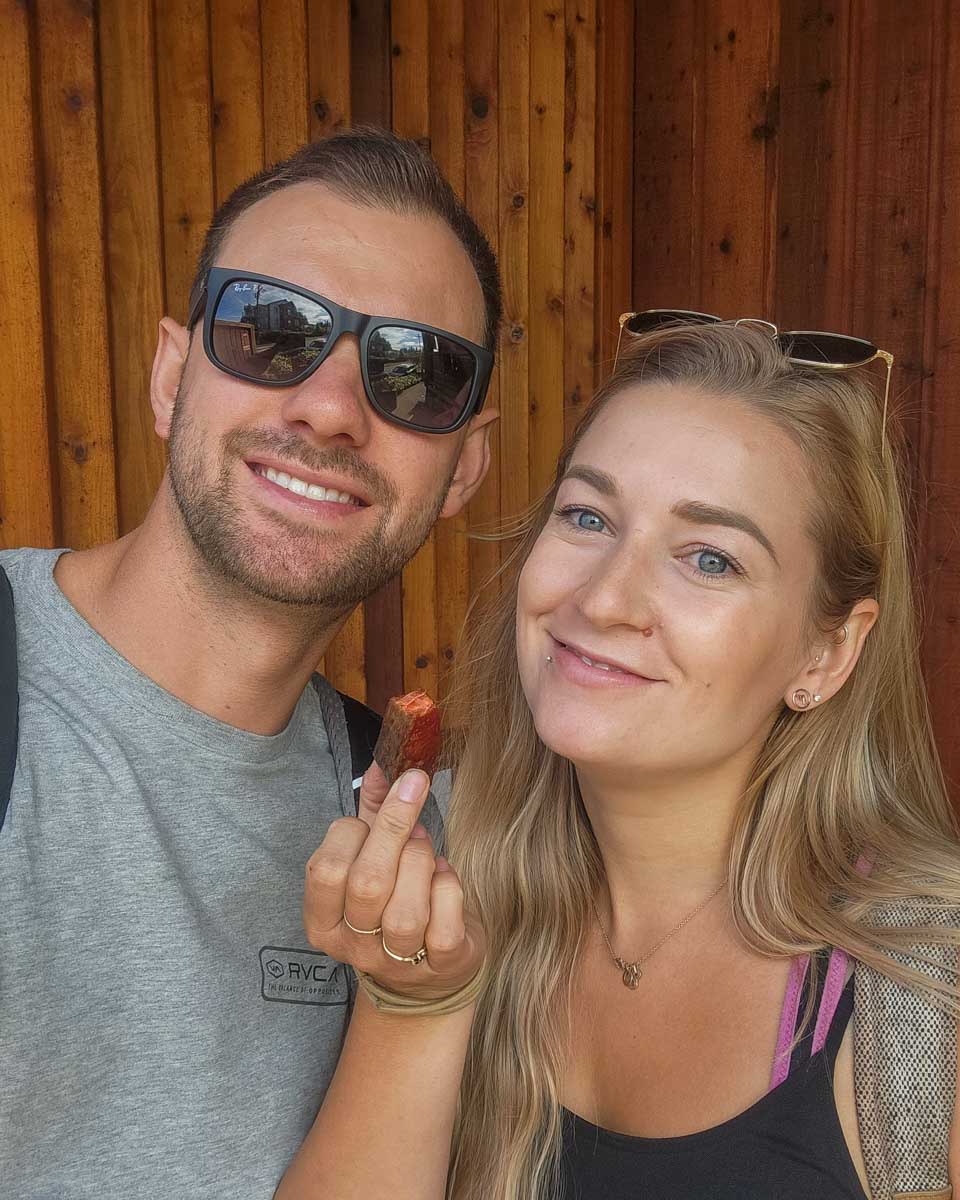 Bailey and Daniel enjoy smoke fish from the Dockside Smoked Fish Store in Tofino