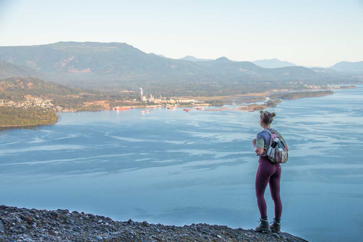 Bailey stands at the top of Mount Erskine looking at the view on Salt Spring Island