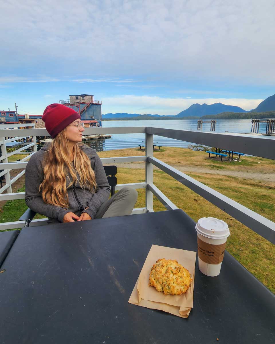 Bailey with a scone at coffee at Savary Island Pie Company along the waterfront in Tofino.