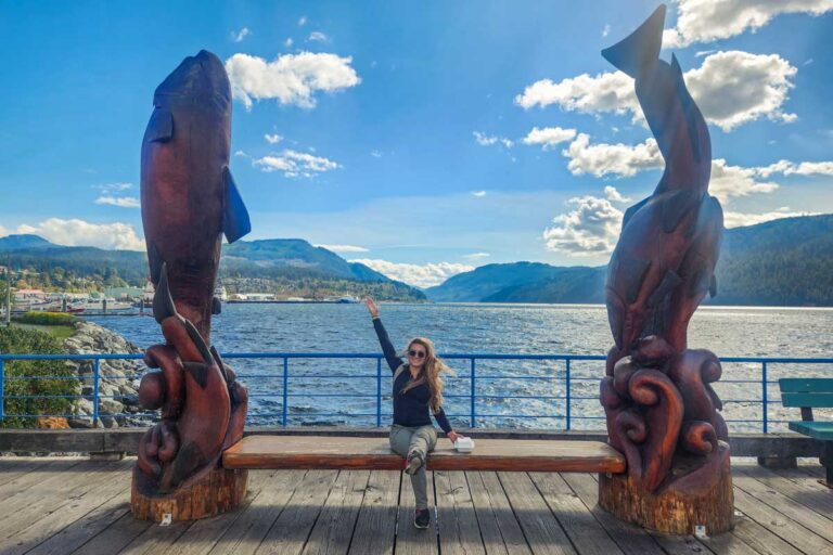 Bailey with the totems at rbor Quay in Port Alberni, BC