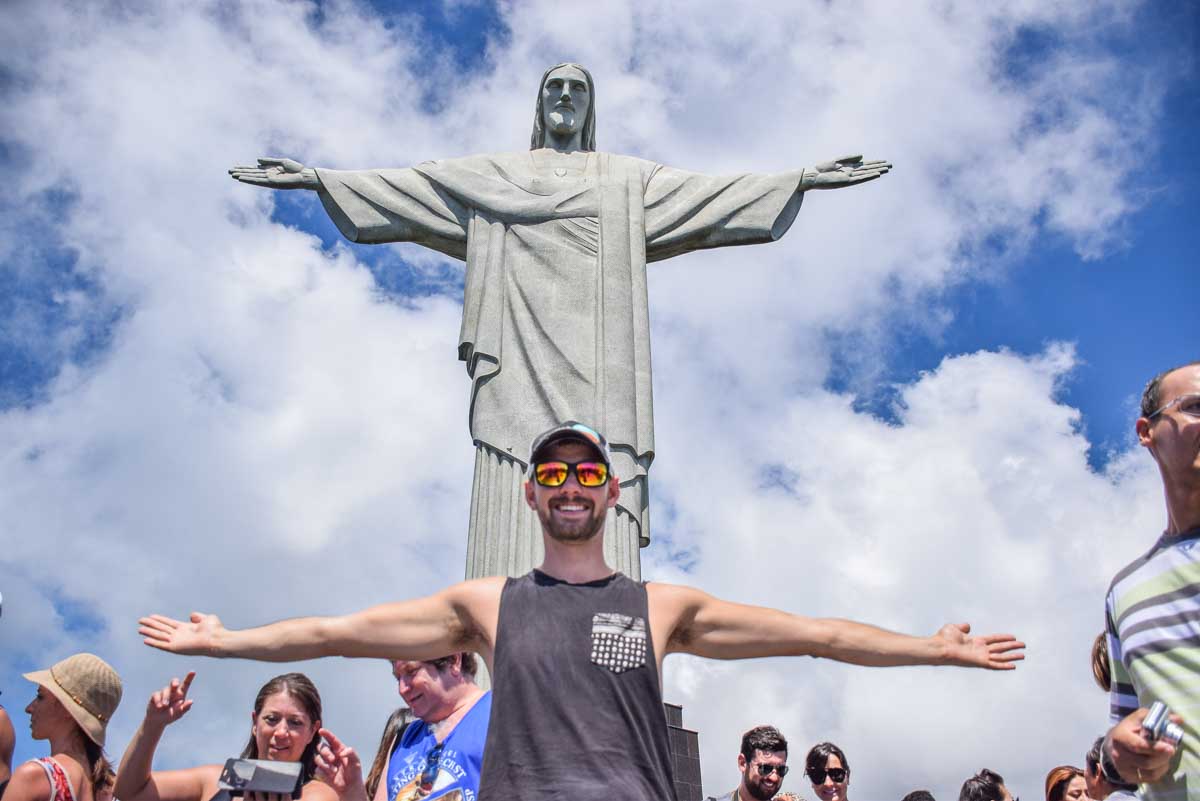 Daniel poses with the Christ the Redeemer Statue in Rio