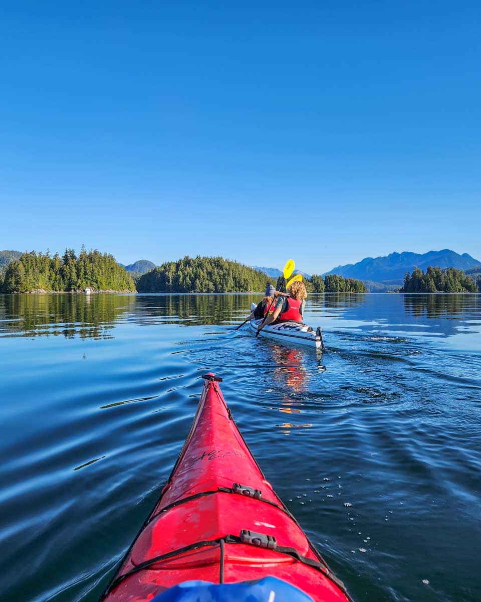 Two kayaks in the water kayaking around the islands of Tofino