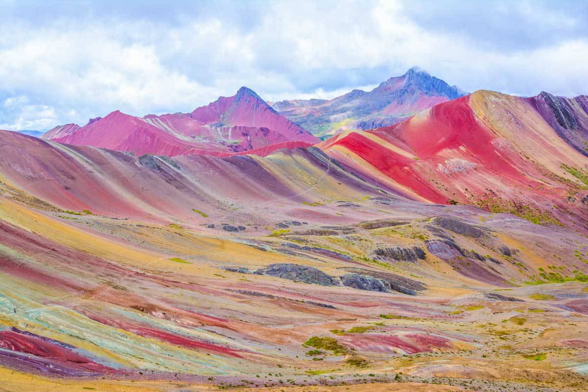 View of the colorful peaks of Rainbow Mountain near Cusco Peru also known as Vinicunca.