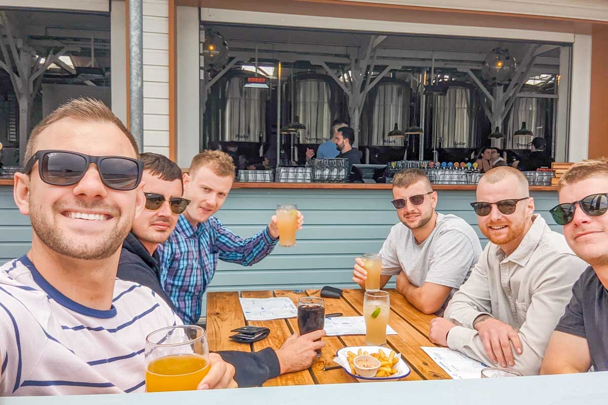 A group of people take a selfie at Gage Roads Brewery, Perth