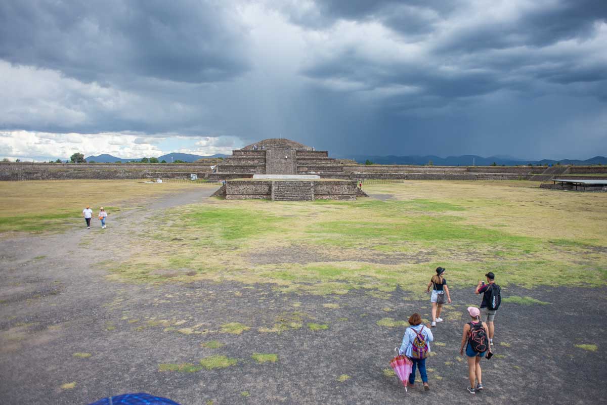 A group of people walk through Teotihuacan, Mexico