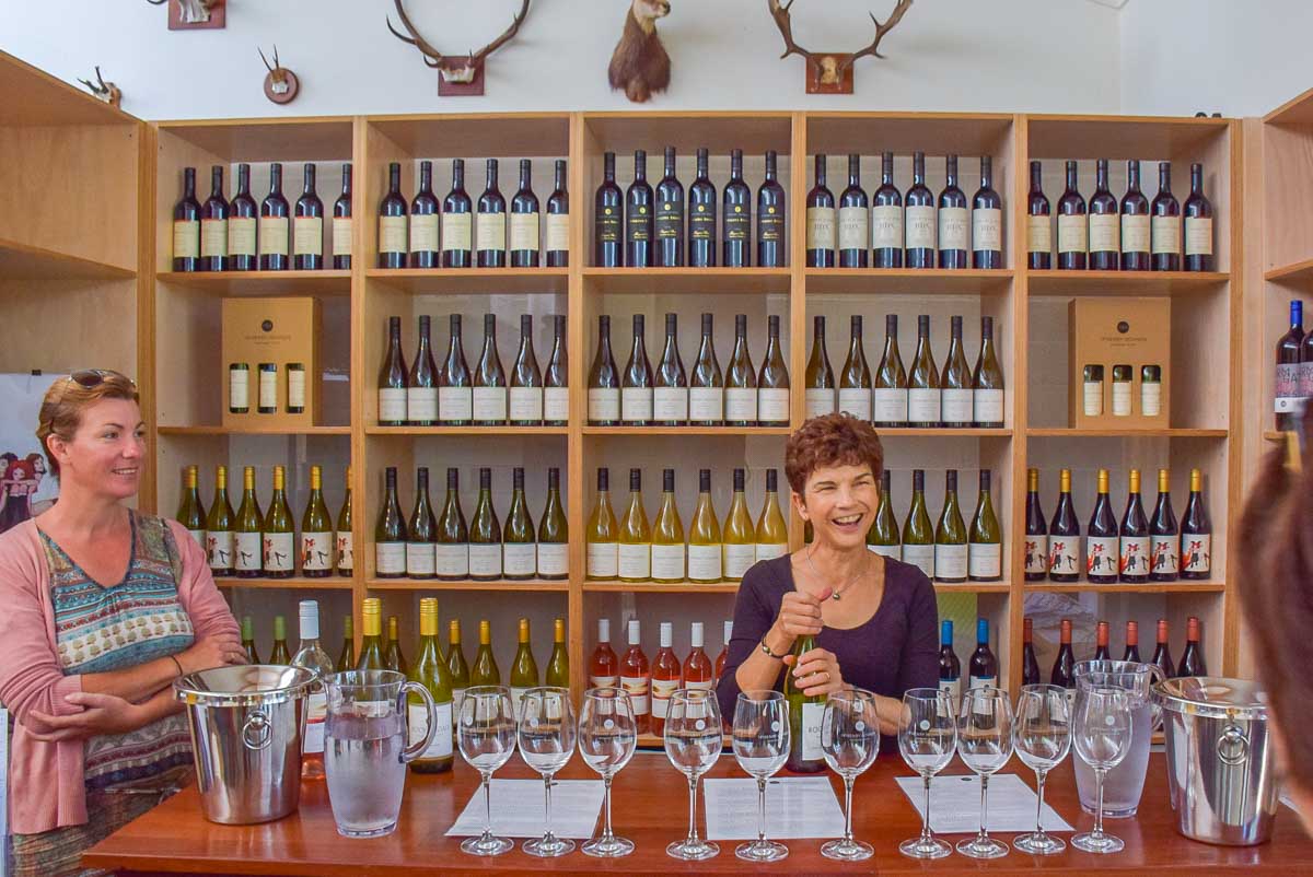 A lady pours wine at a winery in Margaret River, WA