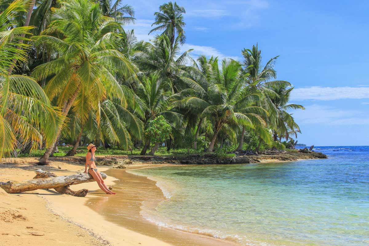 A lady relaxes on a beautiful beach in the San Blas Islands