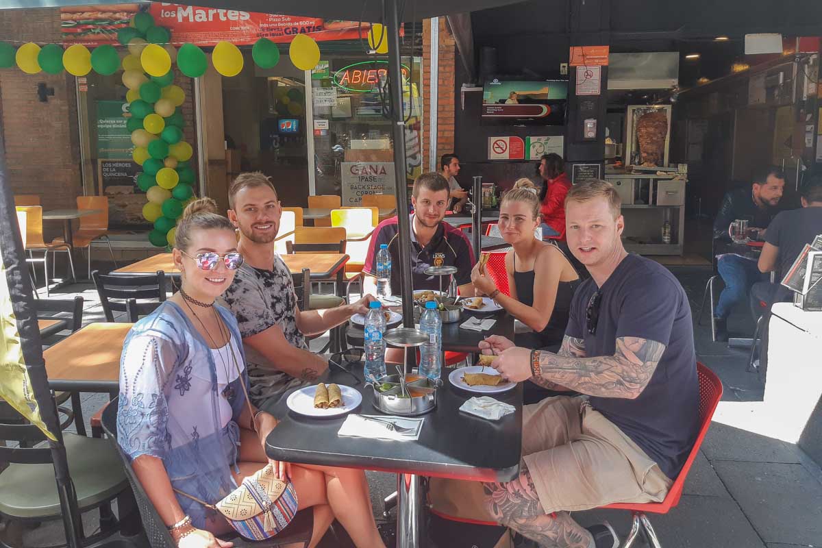 Bailey and Daniel with friends in Mexico City eating at a taco restaurant
