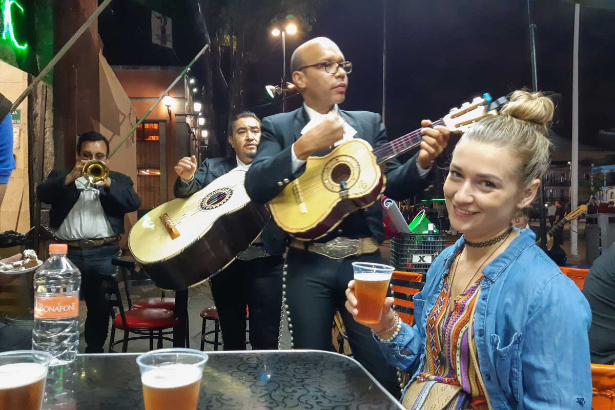 Bailey listens to a mariachi band while out at night in Mexico City, Mexico